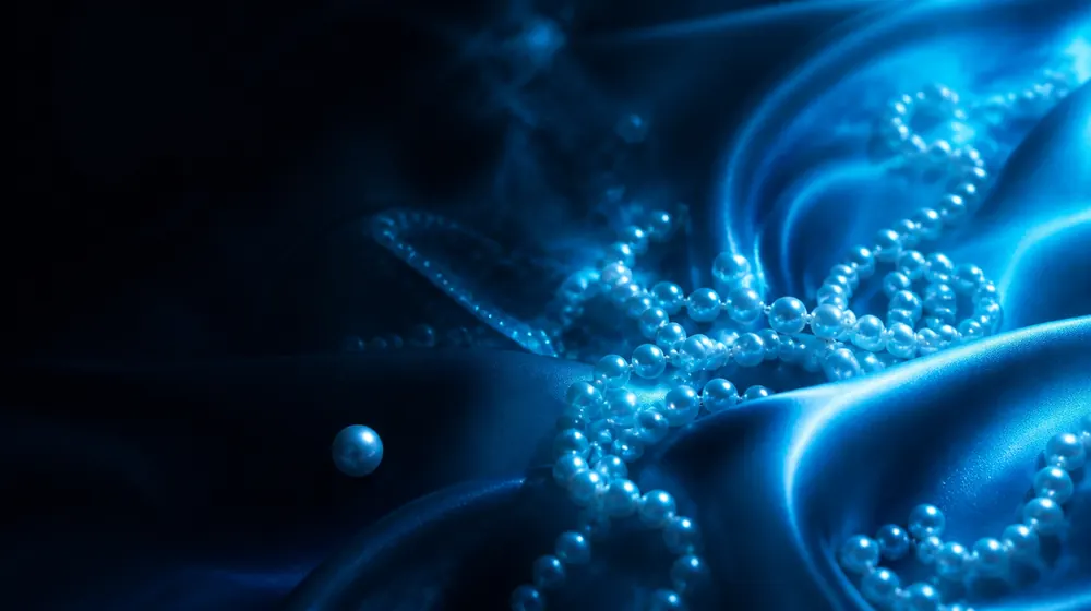 Bukkake OnlyFans creators — silk fabric rippling in cool blue light, pearl strands scattered over dark silk