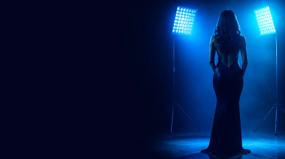 Tattoo Model OnlyFans creators — woman posing under glowing softbox studio lights